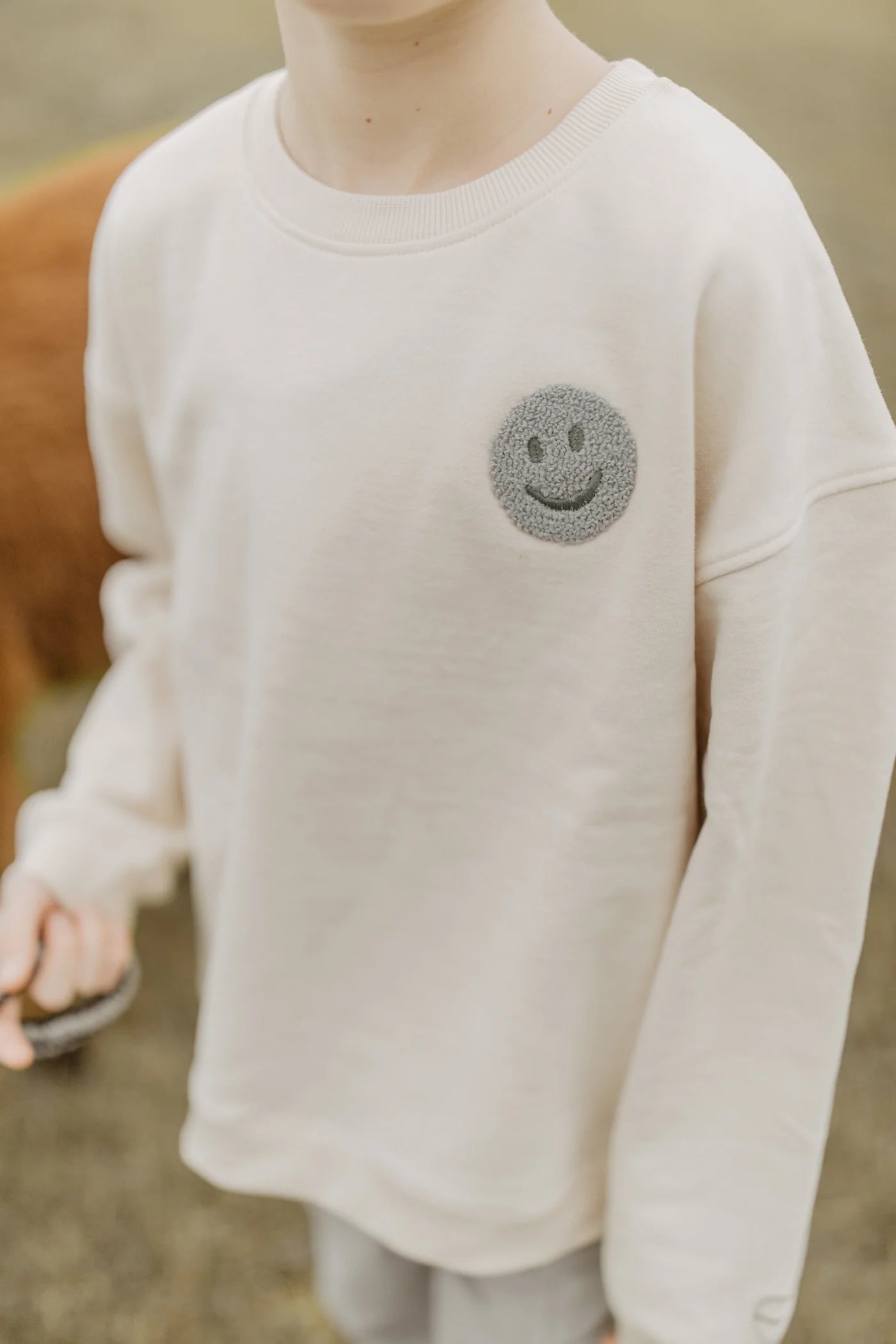 UNISEX OVERSIZED SWEATSHIRT 'PEACE BEGINS WITH A SMILE'