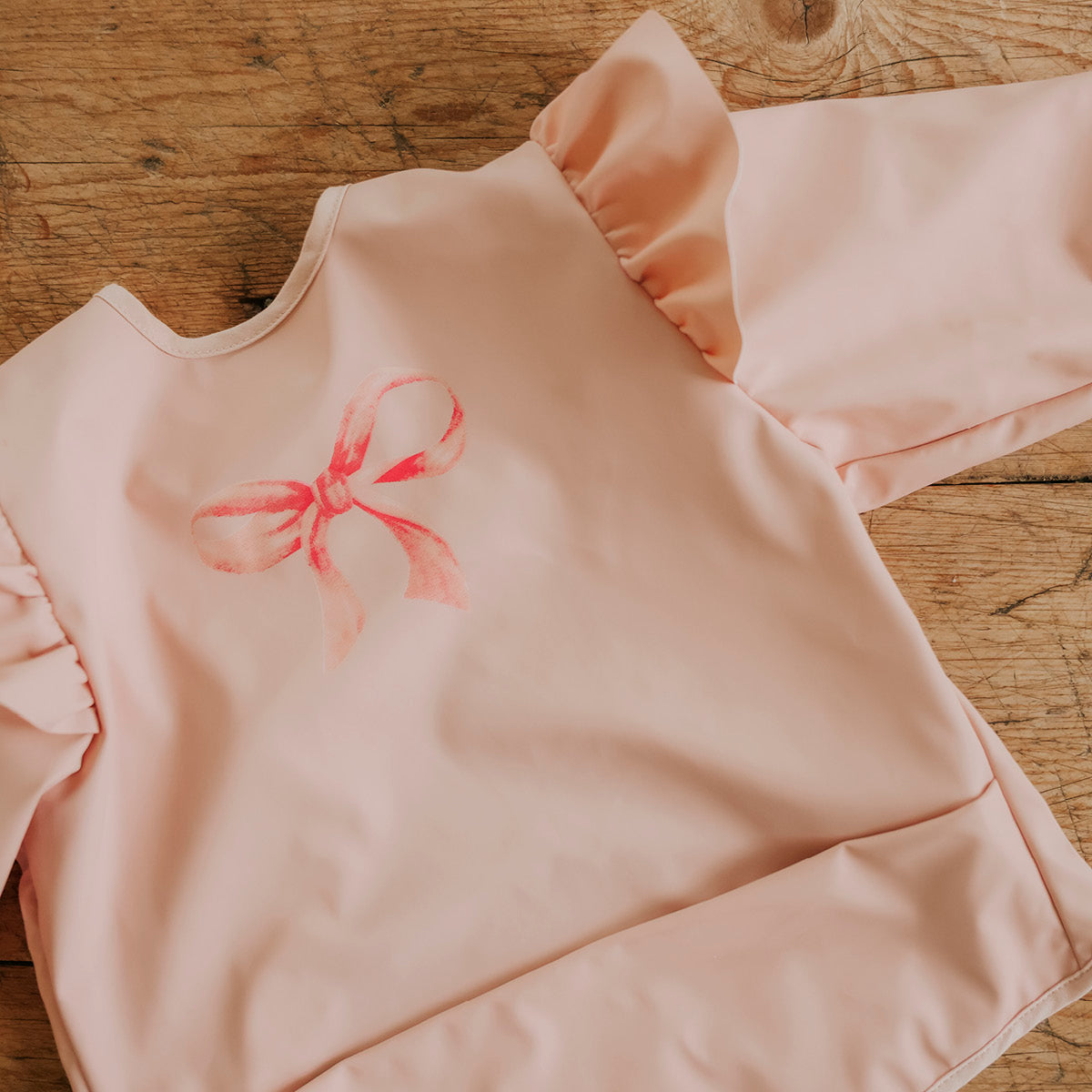Langärmliges LÄTZCHEN - Rosy Bow